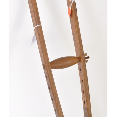 283 - An early 20th-century vintage Bristol, Cossham Memorial Hospital crutch. It features a leather armpi... 