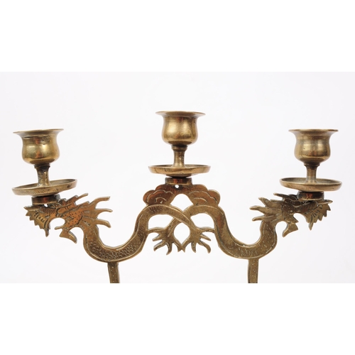 349 - An early 20th century 1920s Chinese stamped brass candelabra. The candelabra featuring three candle ... 