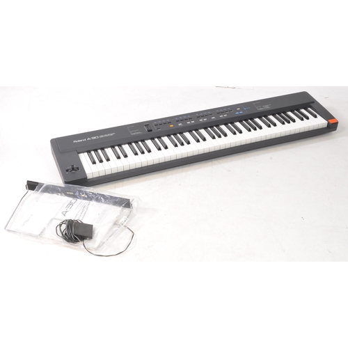 424 - Roland - A 1993 A-30 midi keyboard controller, serial no. AG82565. Manual, power cable, and sheet mu... 