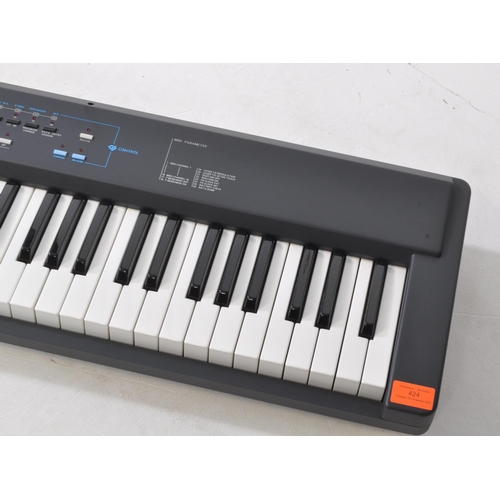 424 - Roland - A 1993 A-30 midi keyboard controller, serial no. AG82565. Manual, power cable, and sheet mu... 