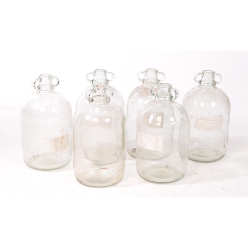 125 - A collection of six vintage 1980s Demijohn glass brewing bottles. Some with labels dating 'October 1... 