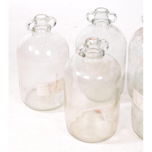 125 - A collection of six vintage 1980s Demijohn glass brewing bottles. Some with labels dating 'October 1... 