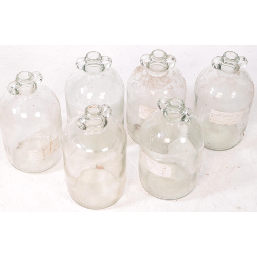 125 - A collection of six vintage 1980s Demijohn glass brewing bottles. Some with labels dating 'October 1... 