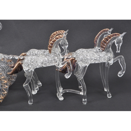 23 - A 20th century studio art glass sculpture of a horse and carriage. The 4-horse drawn carriage with o... 