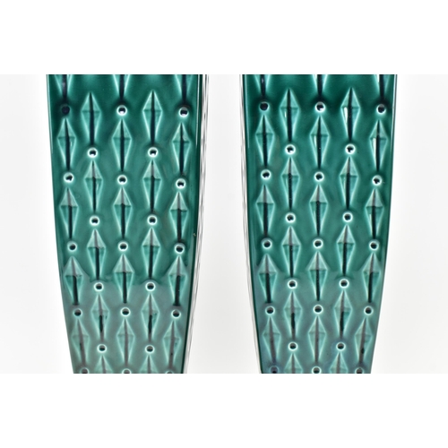 113 - Eastgate - a pair of early 20th century Art Deco green ceramic vases. Each vase of tapering form wit... 