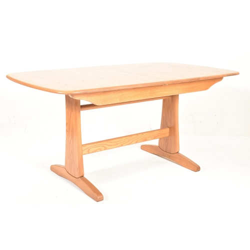 116 - Ercol Furniture - Windsor Rage - a beech & elm extending dining table. The table hving a curved ... 