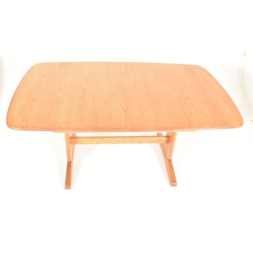 116 - Ercol Furniture - Windsor Rage - a beech & elm extending dining table. The table hving a curved ... 