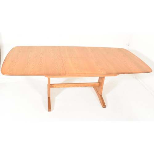 116 - Ercol Furniture - Windsor Rage - a beech & elm extending dining table. The table hving a curved ... 