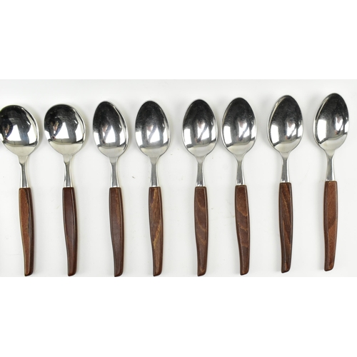 132 - A vintage mid century circa 1970s Danish style teak cutlery canteen. The cased set with thirty-two p... 