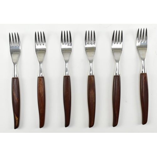 132 - A vintage mid century circa 1970s Danish style teak cutlery canteen. The cased set with thirty-two p... 