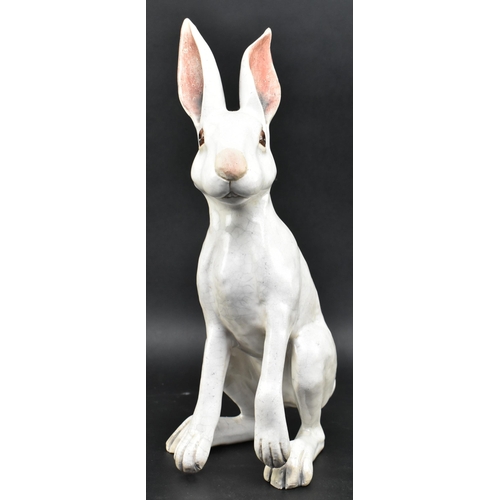 139 - Brian Andrews - a vintage raku glazed studio pottery figurine of a hare. The hare depicting standing... 