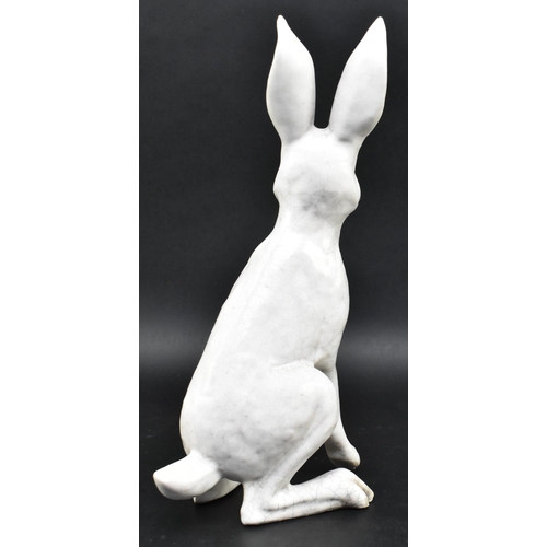 139 - Brian Andrews - a vintage raku glazed studio pottery figurine of a hare. The hare depicting standing... 