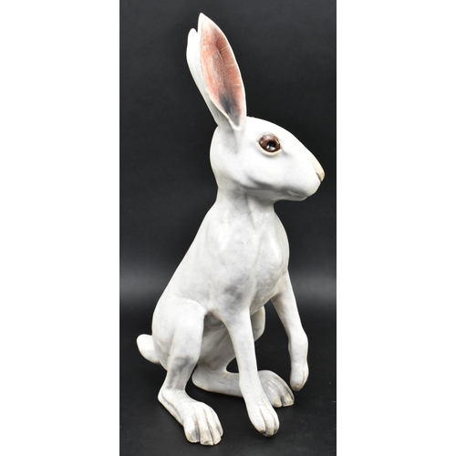 139 - Brian Andrews - a vintage raku glazed studio pottery figurine of a hare. The hare depicting standing... 