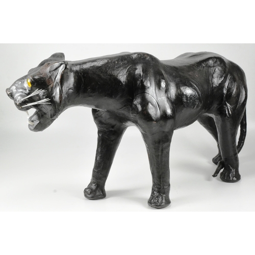 142 - An early to mid 20th century vintage leather covered model of a panther / big cat, in the manner of ... 