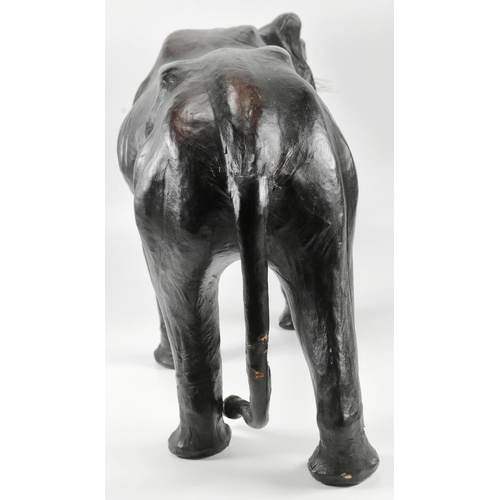 142 - An early to mid 20th century vintage leather covered model of a panther / big cat, in the manner of ... 