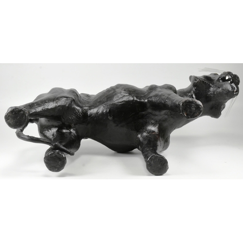 142 - An early to mid 20th century vintage leather covered model of a panther / big cat, in the manner of ... 