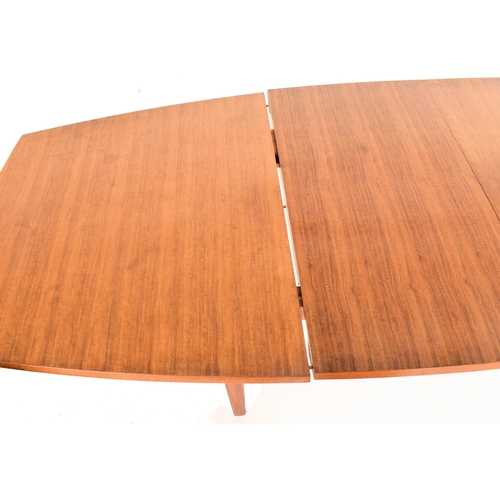 158 - Gordon Russell of Broadway is a large retro mid-20th-century teak wood extending dining table. The t... 