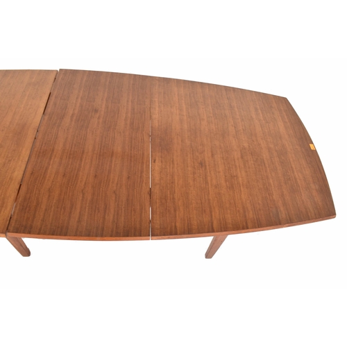 158 - Gordon Russell of Broadway is a large retro mid-20th-century teak wood extending dining table. The t... 