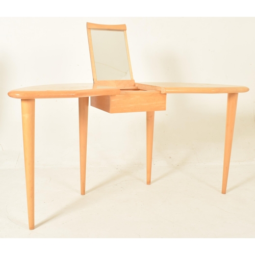 16 - A contemporary designer maple wood dressing table desk. The table having a kidney-shaped top with a ... 