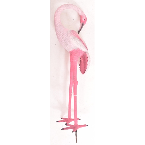 163 - A retro 1970s cast aluminium painted garden display flamingo. The flamingo hand painted in pink, rai... 