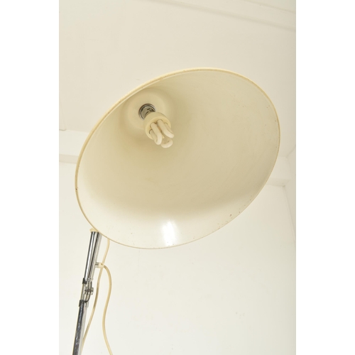 166 - A contemporary Stilnovo manner floor standing lamp light. The lamp having a large cream conical shad... 