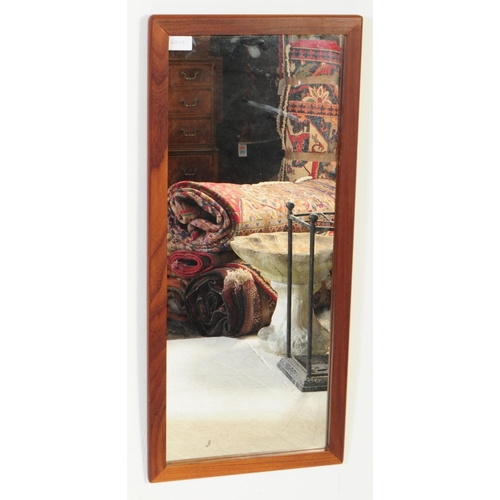 183 - A retro 20th century mid century atomic-style solid teak wall hanging mirror of A-symmetrical form. ... 