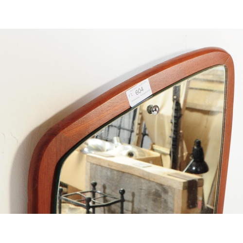 183 - A retro 20th century mid century atomic-style solid teak wall hanging mirror of A-symmetrical form. ... 