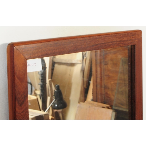 183 - A retro 20th century mid century atomic-style solid teak wall hanging mirror of A-symmetrical form. ... 