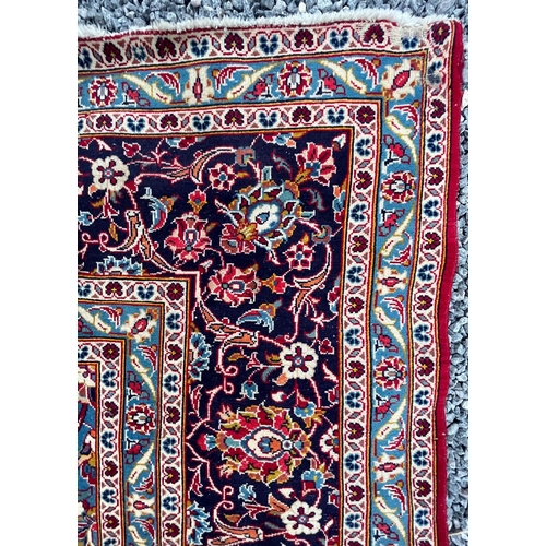 203 - A large 20th century Persian Islamic Tabriz floor carpet rug. The carpet having a central medallion ... 