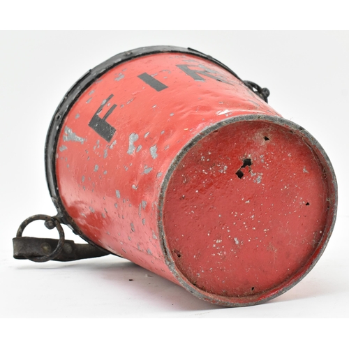 206 - An early 20th century black & red painted metal fire bucket. The bucket with leather adjustable hand... 