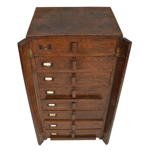 210 - An early 20th century circa 1930s oak wood Wellington upright chest of drawers / filing cabinet. The... 