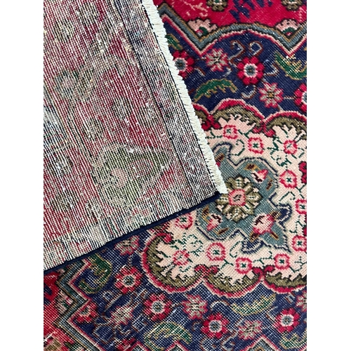 213 - A 20th century Persian Islamic Tabriz floor carpet rug. The carpet having a cream & blue ground ... 