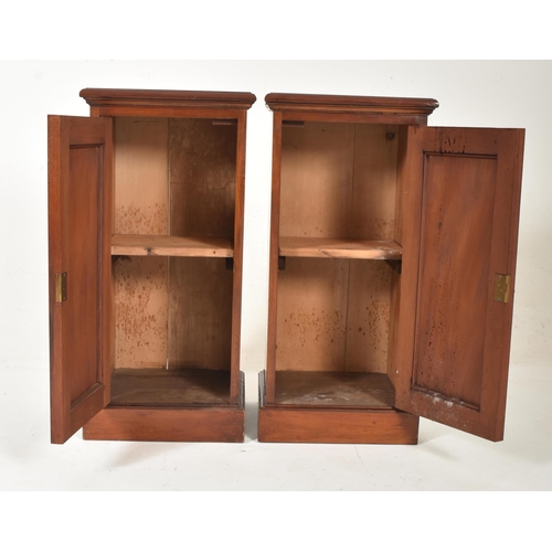 216 - A pair of early 20th century Edwardian mahogany pedestal bedside cabinets / cupboards. Each having a... 