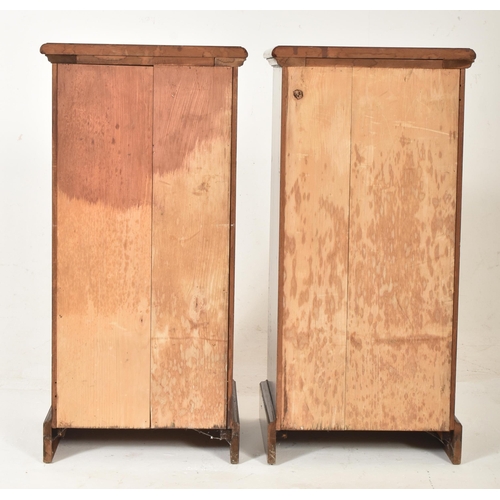 216 - A pair of early 20th century Edwardian mahogany pedestal bedside cabinets / cupboards. Each having a... 