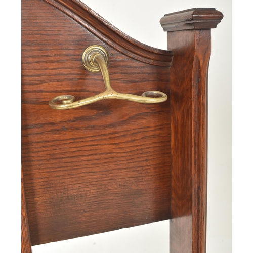 220 - A High Victorian late 19th century oak & brass gentleman's vanity hall stick stand. The stand having... 