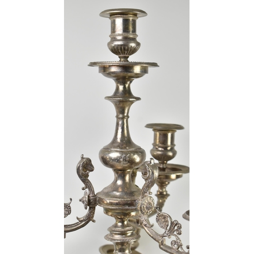 225 - A large pair of French Empire electroplated / silver-plated seven arm candelabras. Each candelabra h... 