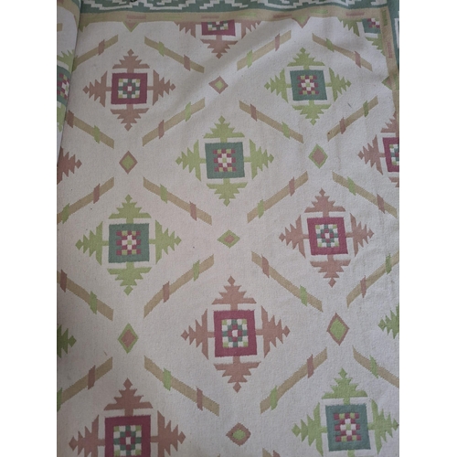 228 - A large 20th century Ikat machine woven floor carpet rug. Large rectangular form having a cream fill... 