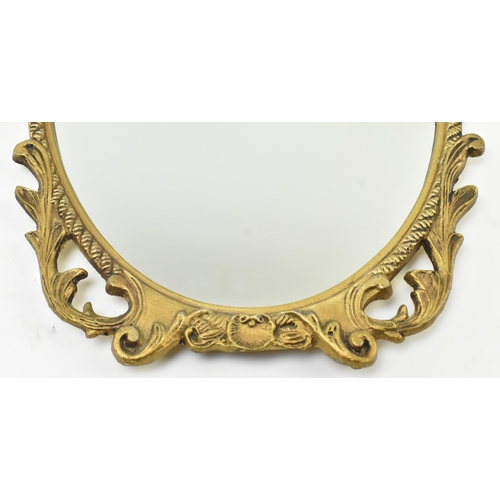 239 - Cast Craft - a matching pair of mid century gilt metal framed mirrors. Each having acanthus pierced ... 