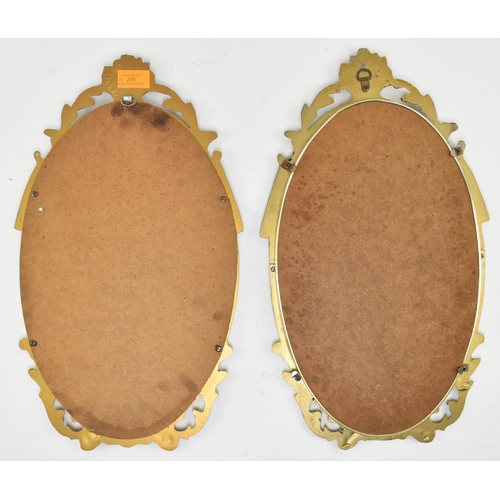 239 - Cast Craft - a matching pair of mid century gilt metal framed mirrors. Each having acanthus pierced ... 