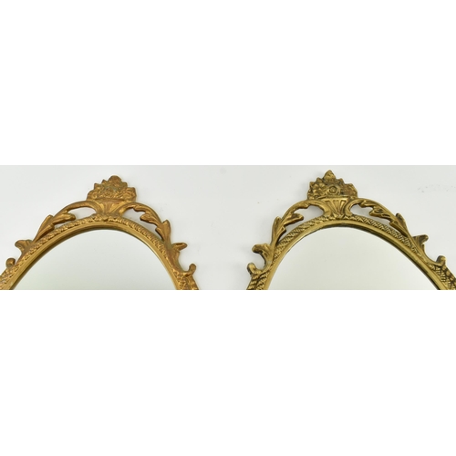 239 - Cast Craft - a matching pair of mid century gilt metal framed mirrors. Each having acanthus pierced ... 