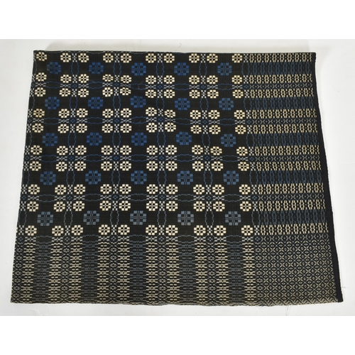 247 - A vintage 20th century hand woollen traditional Welsh blanket. The blanket in wintery tones of blue ... 