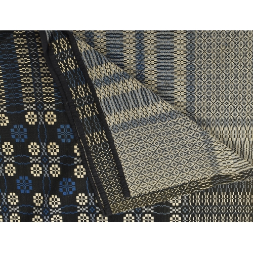 247 - A vintage 20th century hand woollen traditional Welsh blanket. The blanket in wintery tones of blue ... 