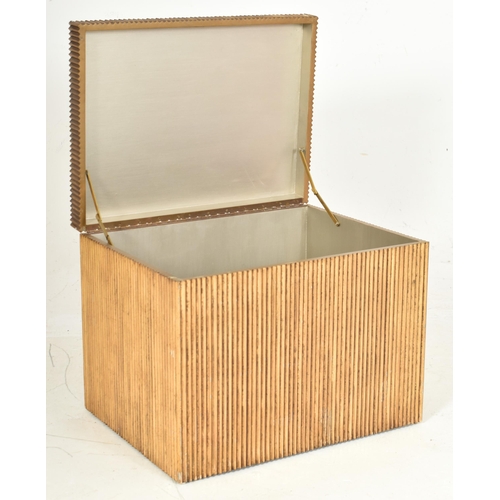 248 - A contemporary Hollywood Regency gilt and reeded blanket / storage box. The box of square form havin... 