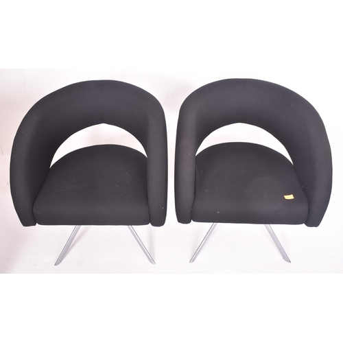 256 - Boss Design - a pair of vintage upholstered black office armchairs. Each tub armchair with curved up... 