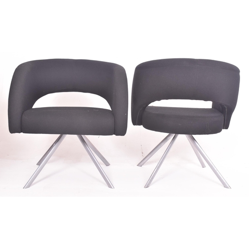 256 - Boss Design - a pair of vintage upholstered black office armchairs. Each tub armchair with curved up... 