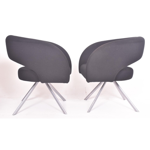 256 - Boss Design - a pair of vintage upholstered black office armchairs. Each tub armchair with curved up... 