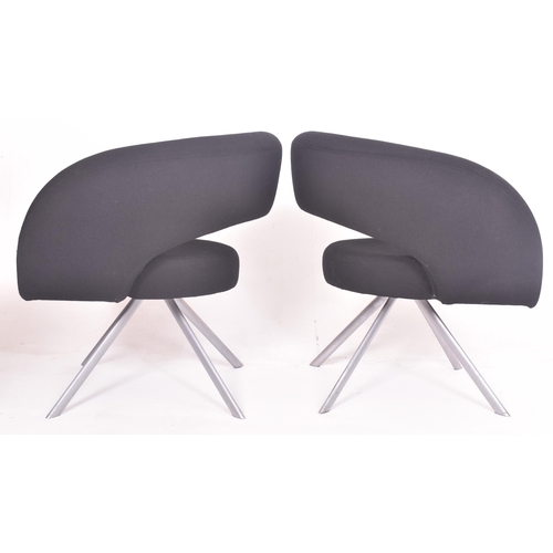 256 - Boss Design - a pair of vintage upholstered black office armchairs. Each tub armchair with curved up... 