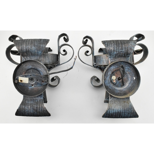 287 - A pair of vintage wrought iron and Murano inspired glass rustic wall sconces lights. Each sconce hav... 