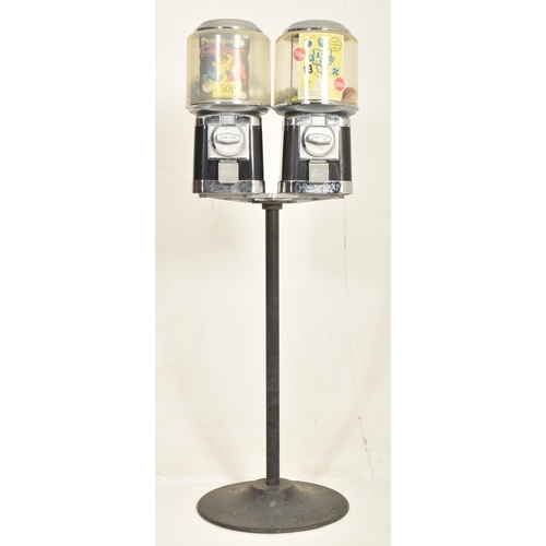 291 - Beaver - two vintage 20p coin operated black sweet shop candy vending machines on stand. Each confec... 