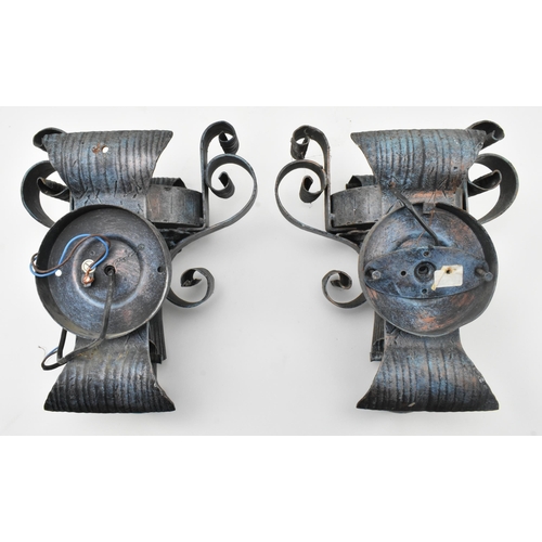 301 - A pair of vintage wrought iron and Murano inspired glass rustic wall sconces lights. Each sconce hav... 